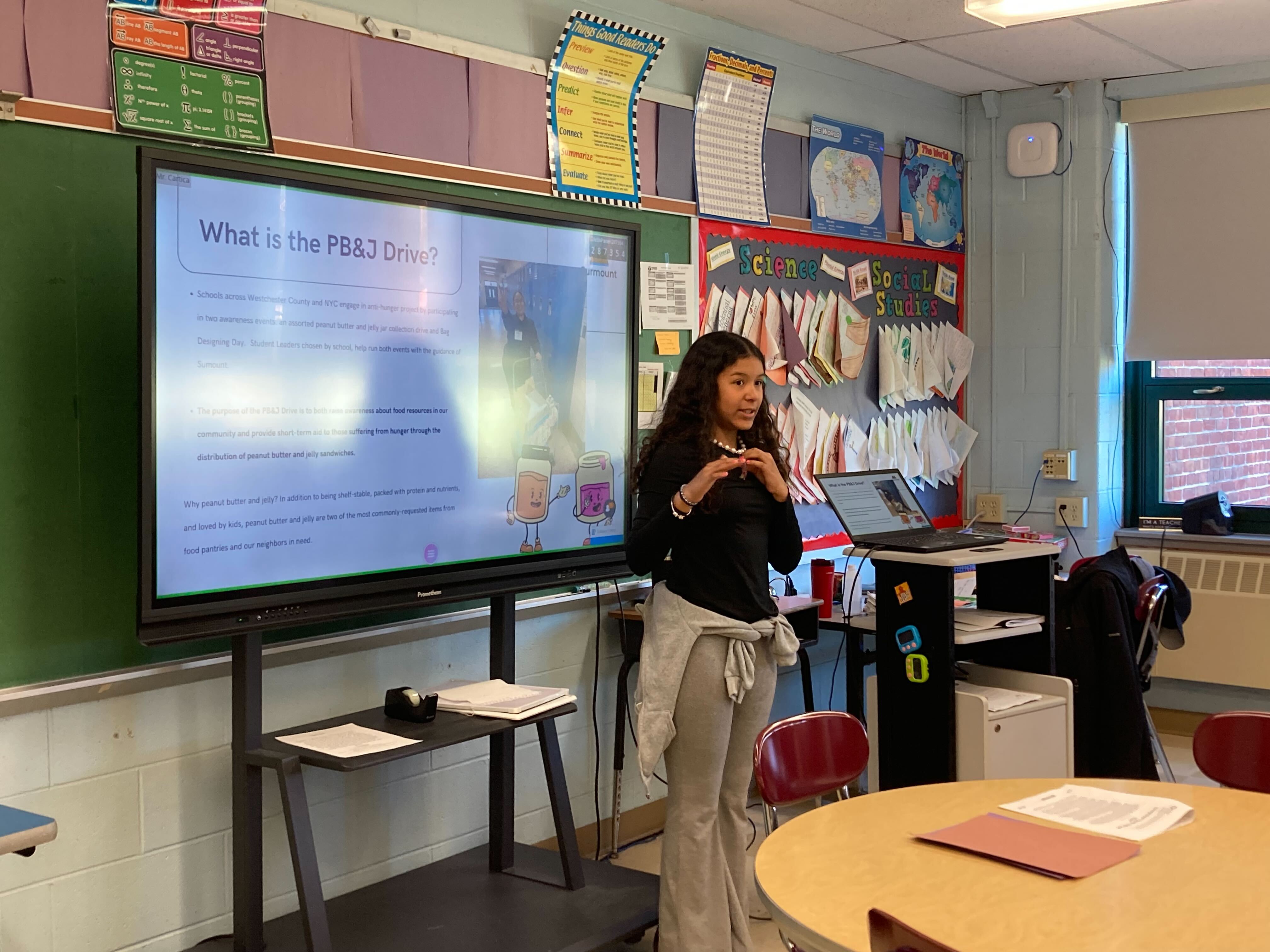 A student presents the PB and J Drive to classmates